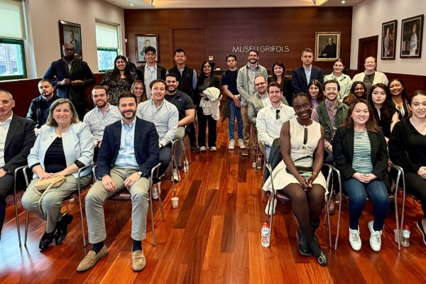 A group of people seated in a room.