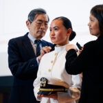 Rose Jou being pinned by her parents at the Cornell University ROTC Tri-Service Commissioning Ceremony, held May 23 in Statler Auditorium.