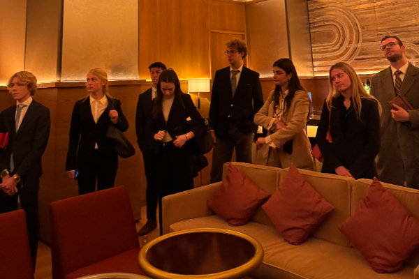 A large group of students at a speakeasy within the restaurant called "Zou Zou"