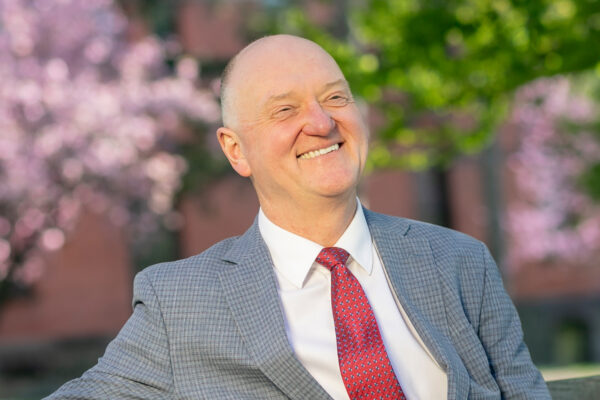 Headshot of Andrew Karolyi.