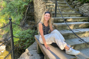 Kyra Stiggelbout, MBA '24 wearing New Balances to indicate her sustainability internship experience at New Balance as part of SIIF