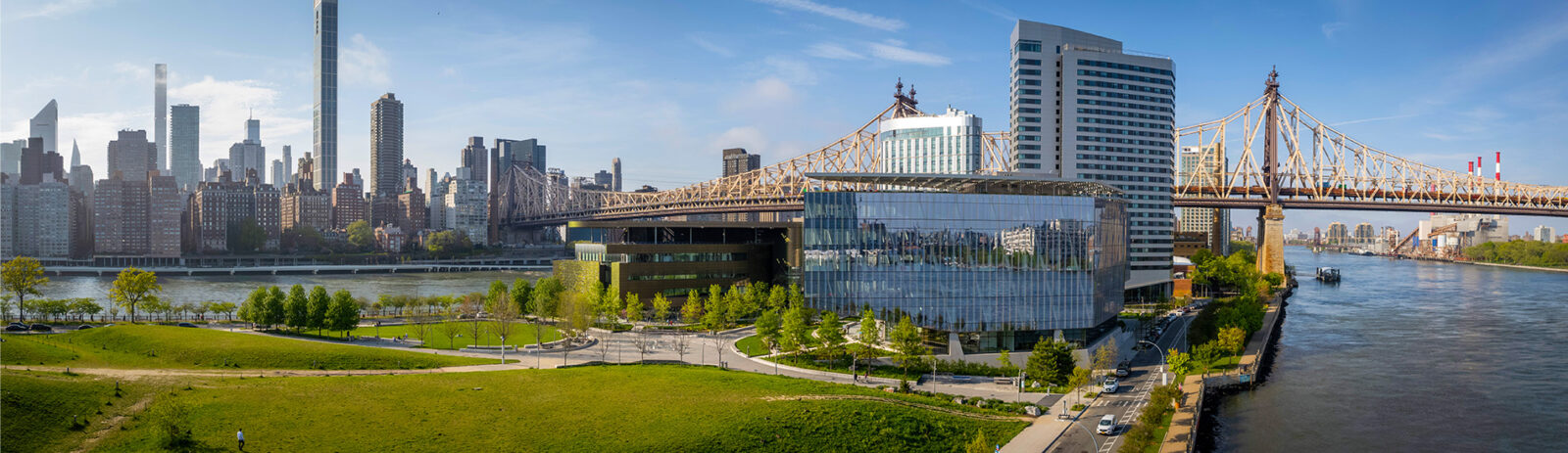 Cornell Tech campus on Roosevelt Island with the Manhattan Skyline visible in the background.