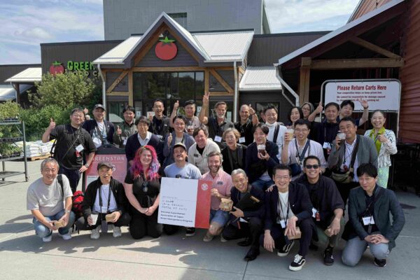 Japanese executives outside supermarket