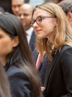 Young woman dressed in business formal attire.