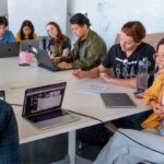 A group of students gathered around a table
