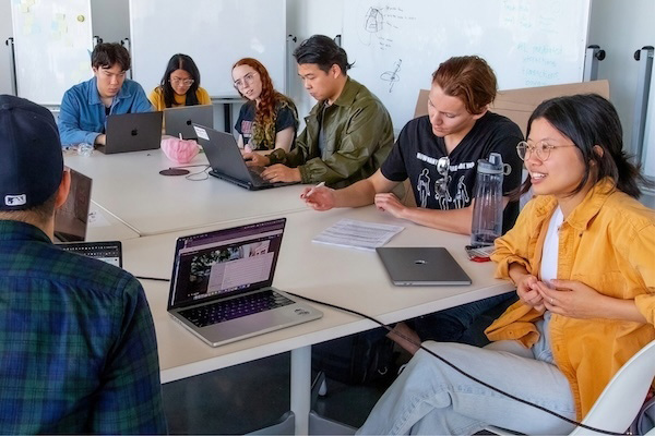 A group of students gathered around a table