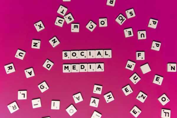 Tiles spelling "Social Media" with random letter tiles scattered around