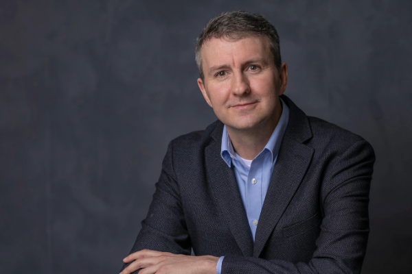 Headshot of Angus Hildreth.