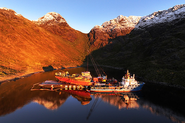 Raising a vessel off the seabed and onto a barge for transport.