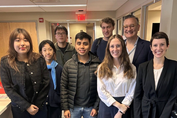 Tom posing with a group of students after a coffee chat while serving as an Entrepreneur in Residence