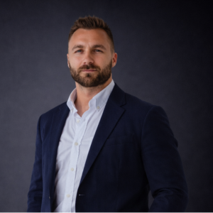 Professional headshot of Ante Mandic with gray background.