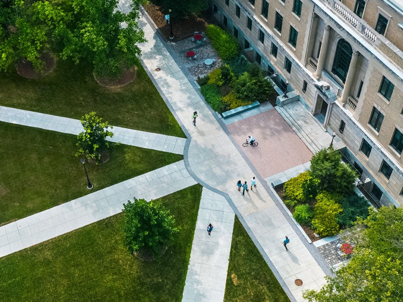 Aerial view of the Ag Quad and Warren Hall, people walking on sidewalks