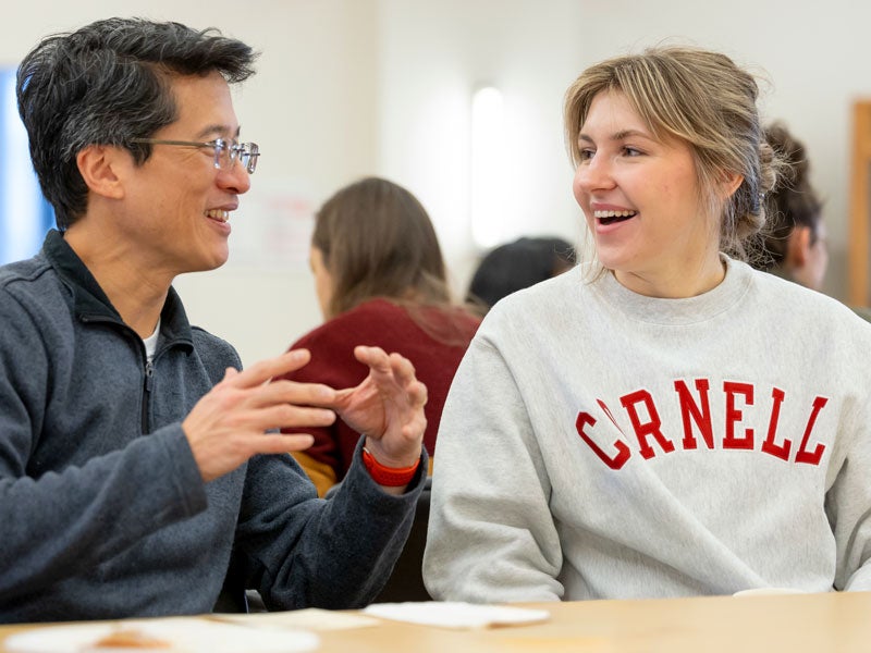 Dyson student speaking to Dean Zhao at Dyson event