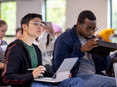 Student participants listening to presentations