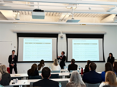 Team SKEMA presents to judges and observers in the final round of the competition. From left: Riccardo Ciruzzi Manin, Giacomo Musso and Emiliana Moscato.