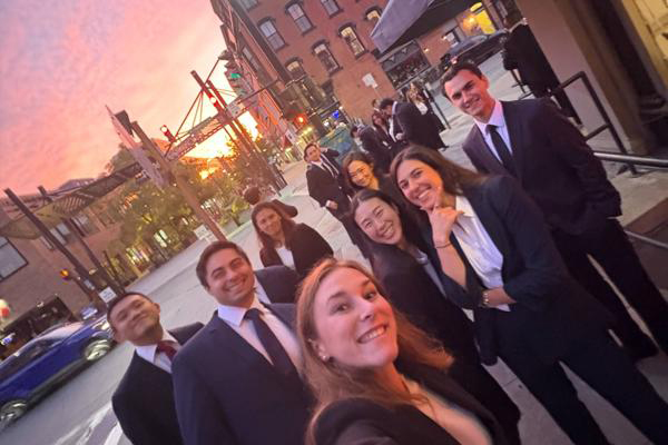 Gillian Grossen, MBA ’27 with new friends enjoying the sunset on our way to networking happy hour
