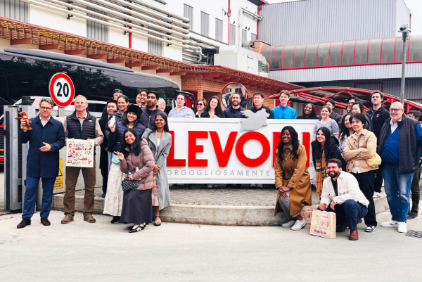 Students pose in front of Levoni in Parma.