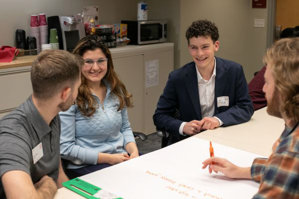 Undergraduate and graduate students connect in PIHE suite to Break the Ice.
