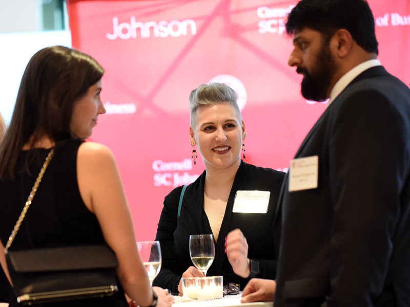 Johnson alumni speaking at table