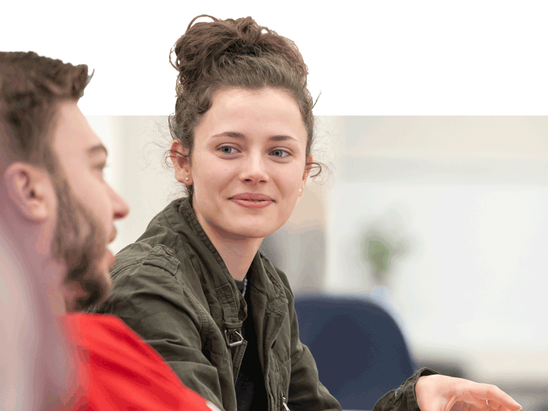 Two students interacting in class