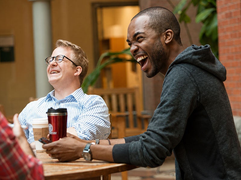 A slice of life at Johnson. Students socialize over coffee in Dyson Atrium.