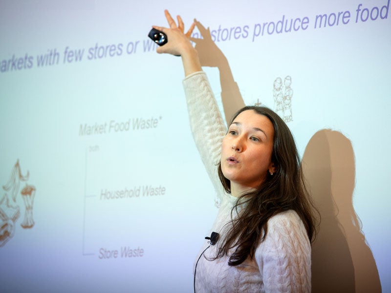 Elena Belavina, associate professor presents during a discussion of leading policy issues related to business, environment and sustainability.