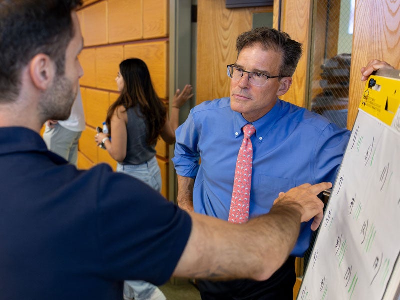 Faculty assisting students with question