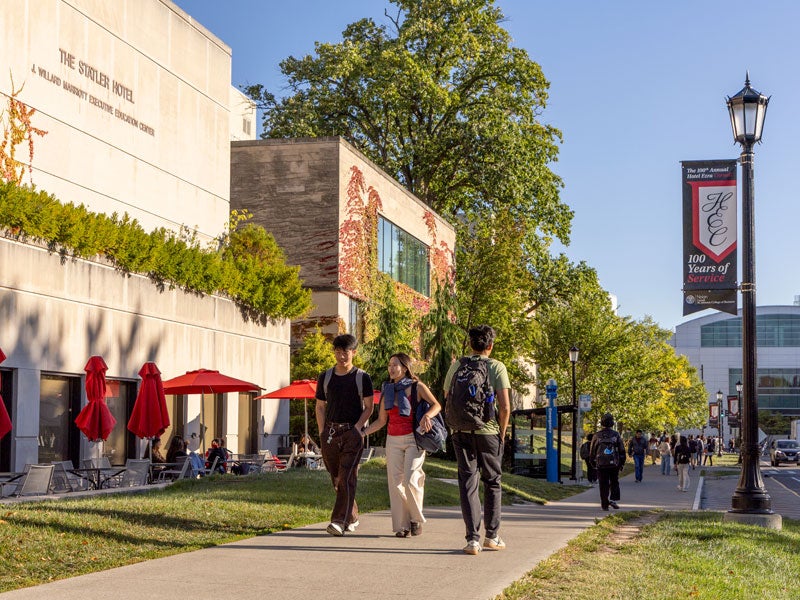 Students walking in front of Statler Hotel on Feeny Way