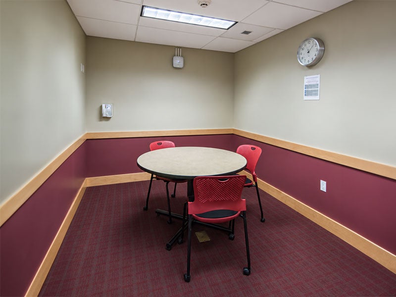 Small group study room with table and chairs. Can seat up to six people.