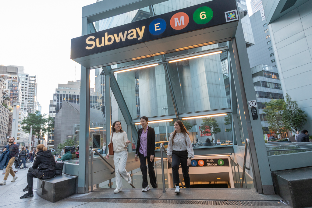 Cornell real estate students in NYC exiting the subway station and walking onto the city streets