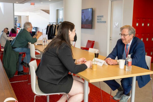 Student talking to his mentor at a mentor forum