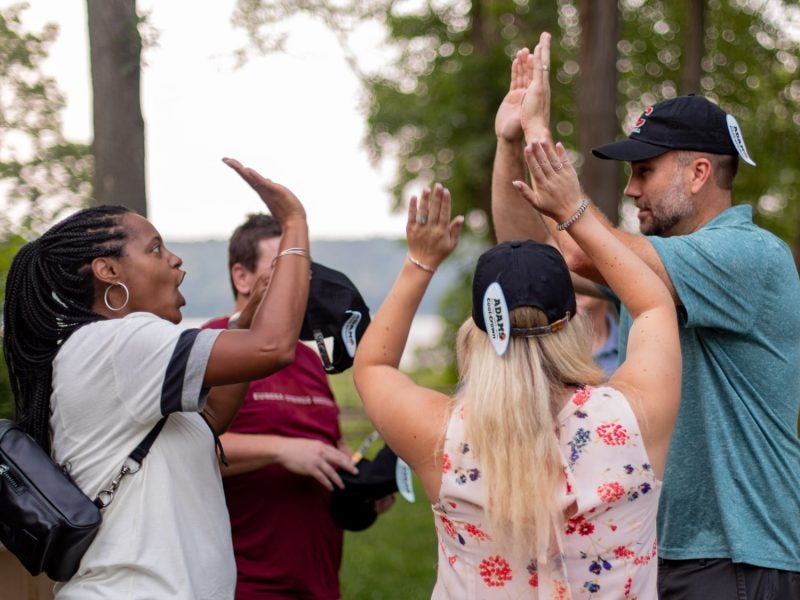 Group of people high-fiving