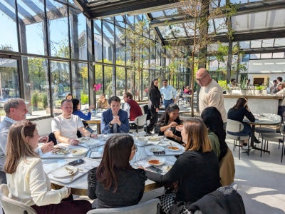 Students enjoying lunch at Davines Village, a global model for regenerative sustainability and employee well-being.