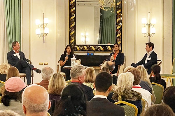 Image of Guzzo speaking on a panel at a Cornell Hotel Society conference and gala in Rome
