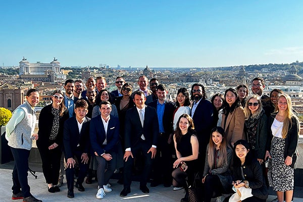 Image of Family Businesses in Italy trek group in April 2022 on the rooftop of Hotel Hassler in Rome at the top of the Spanish Steps with Roberto Wirth Jr., owner of the hotel, with his twin sister, Veruschka Wirth