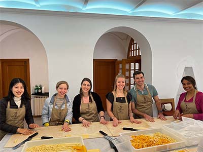 Image of Guzzo making pasta for dinner with other members of the Family Businesses in Italy trek at Hotel Vanucci in Citt&agrave; della Pieve