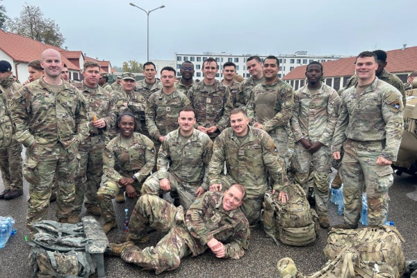 Brandon Jones, MBA &rsquo;27, with military colleagues as part of a NATO battle group in Poland.