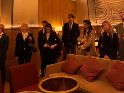 A large group of students at a speakeasy within the restaurant called "Zou Zou"