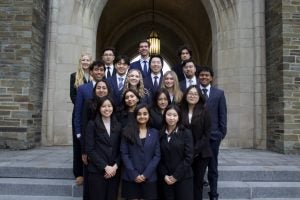 Impact Investing members in front of West Campus buildings.