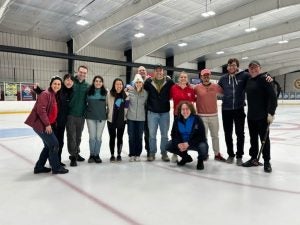 SGE club members on the ice at a curling event at Lynah Rink.
