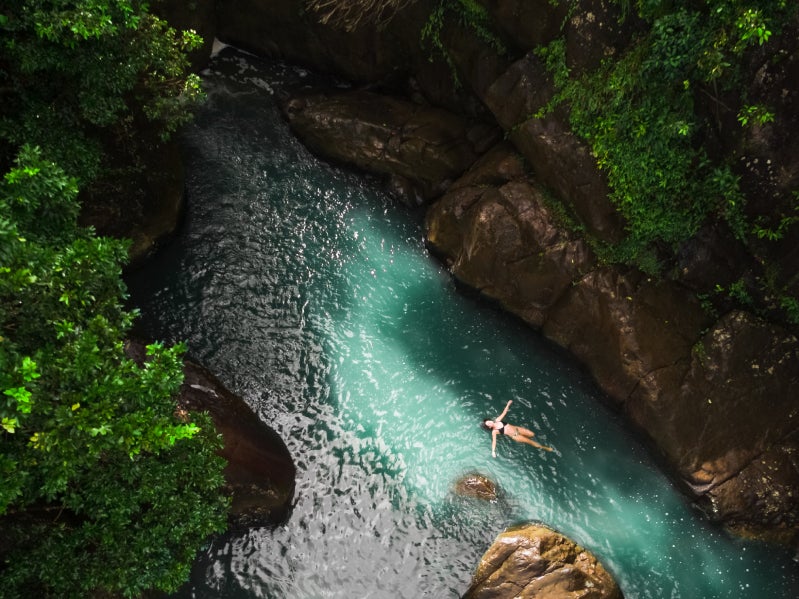 Swimmer floating in water.