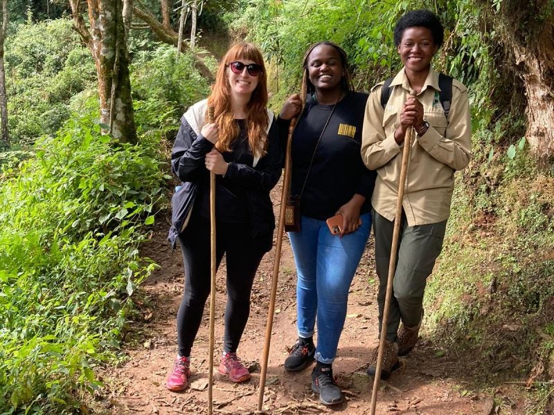 Students pose for a photo on a hiking trail.