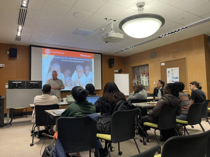 Chris Barrett presenting to a room of people.