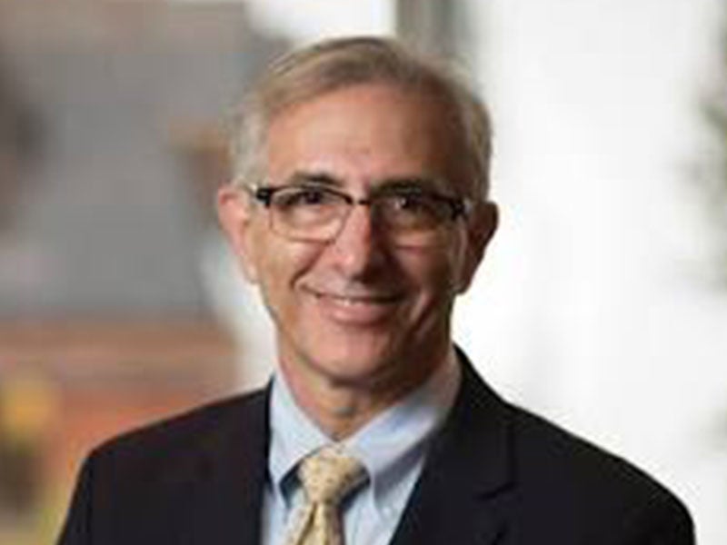 Headshot of Douglas Baumoel.