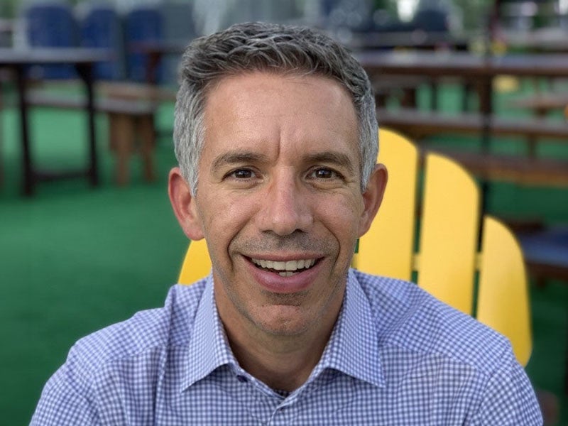 Headshot of Patrick Abouchalache.