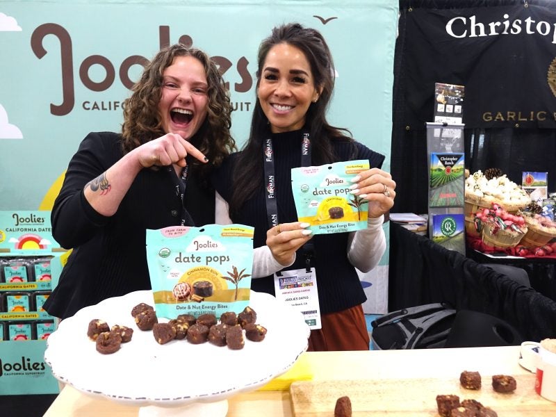 Students stand in front of a display with samples.