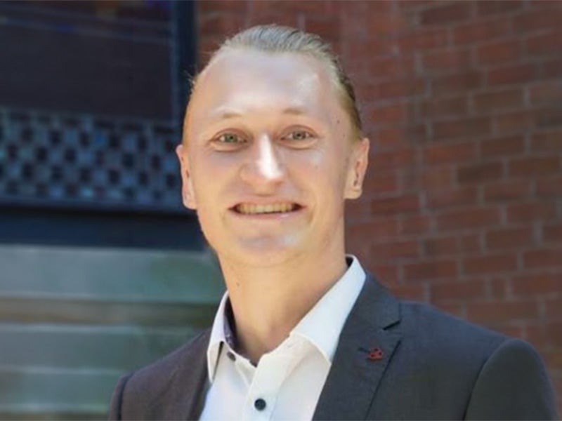 Headshot of Joshua Tolsdorf.