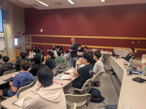Daniel G. Van Der Vliet in a classroom delivering a guest lecture to the students of the Future Founders class.