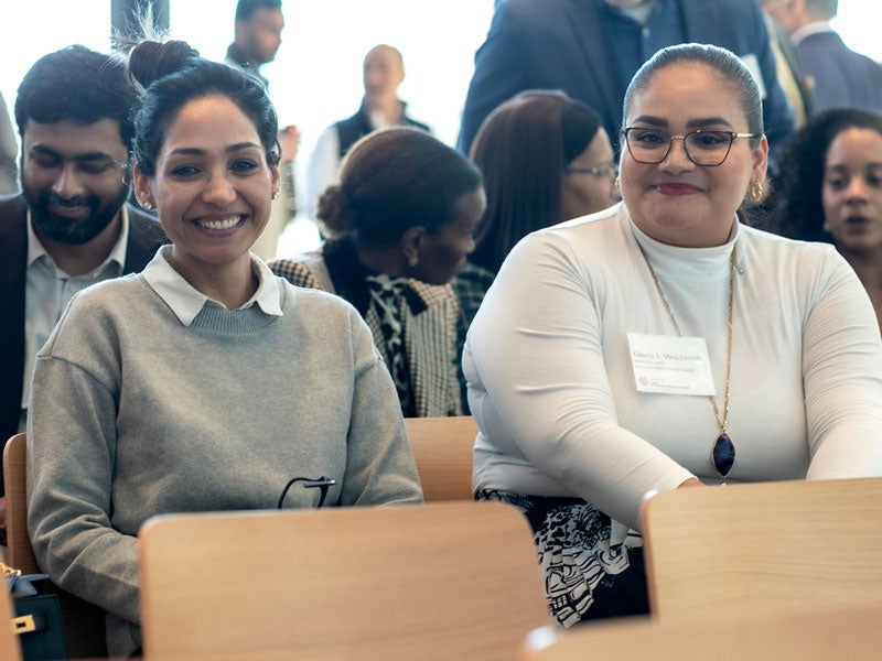 Alumni sitting in audience at Alumni Summit